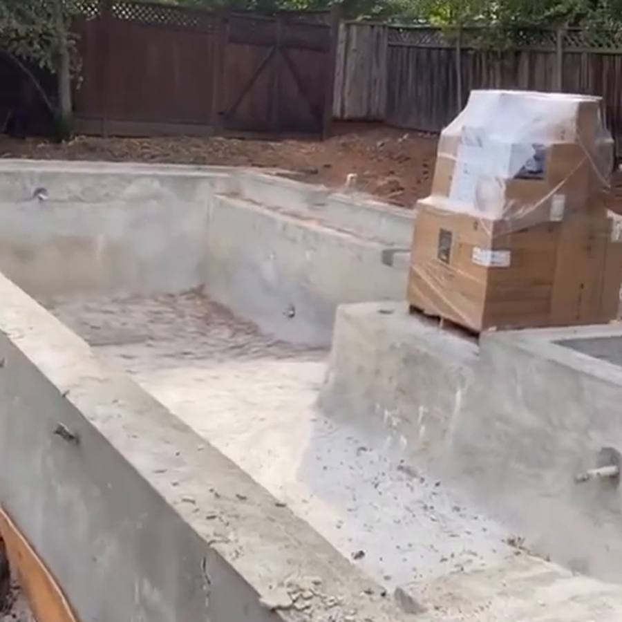 Poured concrete foundation walls and pads with anchor bolts set