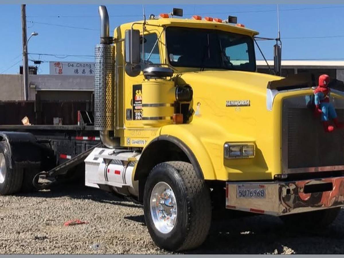 Kenworth roll-off tractor parked at the yard